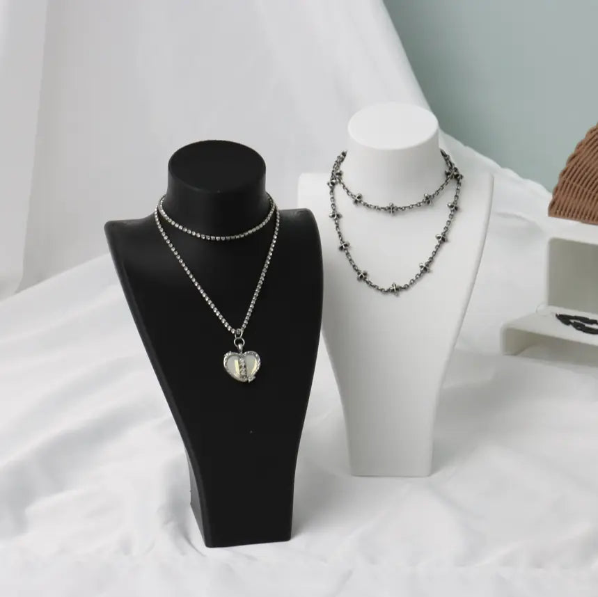 3D - printed necklaces on display stands, showcasing customizable jewelry options, a testament to the versatility of 3D printing in creating unique fashion accessories.