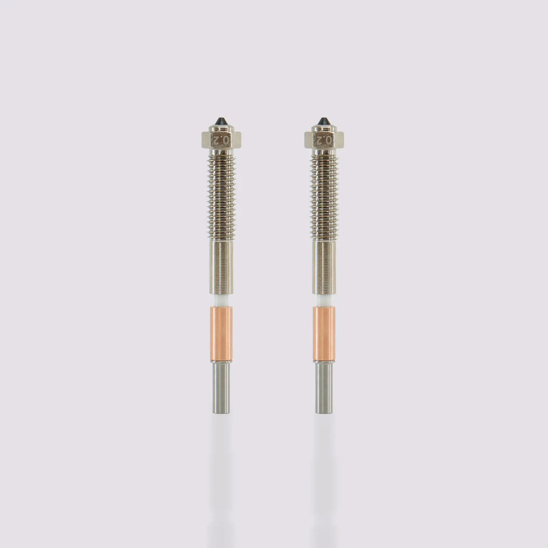 Two QIDI Max4 Bimetal Nozzles with 0.2 mm diameter tips, featuring silver, white, and copper components.
