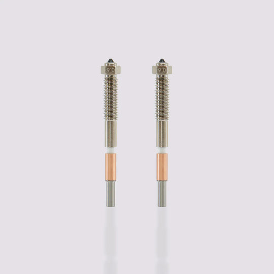 Two QIDI Max4 bimetal nozzles with 0.6mm markings, featuring integrated all-metal design for easy replacement.