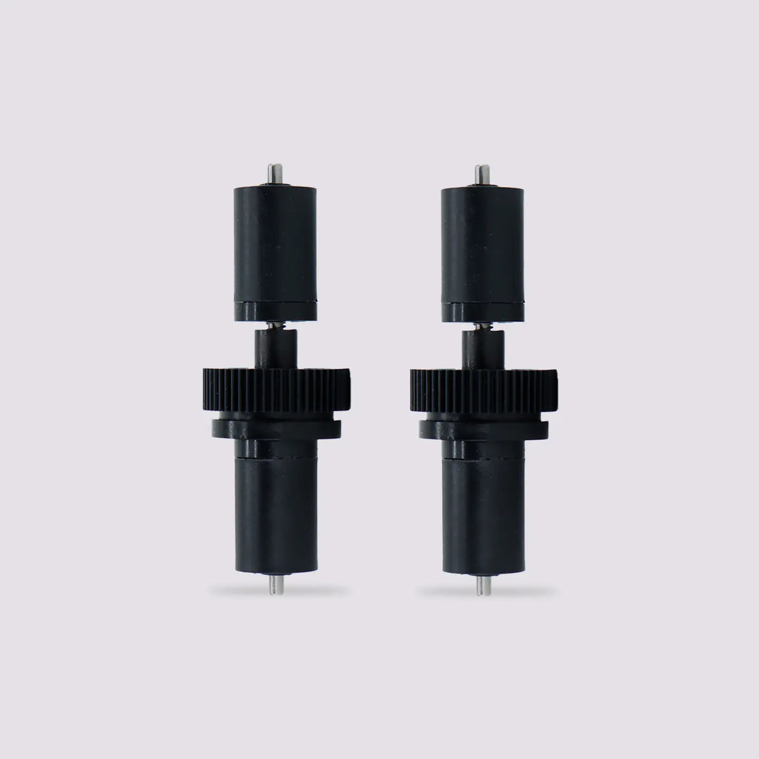Two QIDI BOX active support shaft assemblies with black gears and cylindrical bodies.